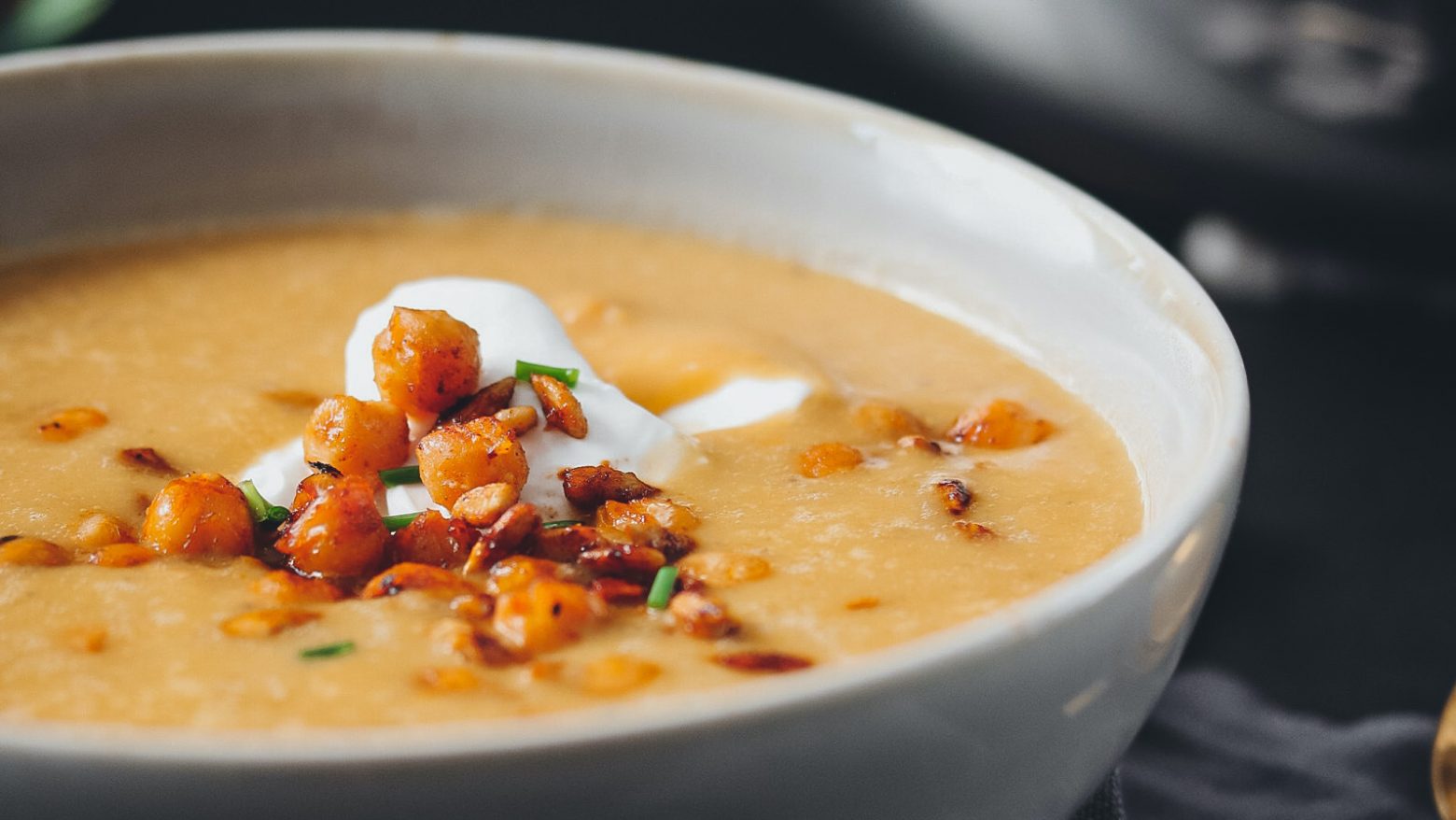 Red lentil soup served with chickpea croutons
