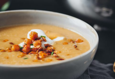 Red lentil soup served with chickpea croutons